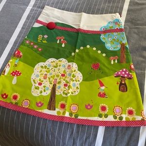 Fun pastoral gnome village print skirt